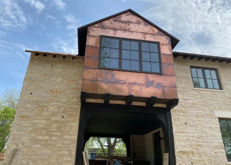 Copper metal panel facade on a stone building for Metal Roof Coating in Franklin Farm
